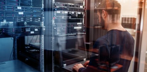 network engineer working in server room